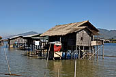 Inle Lake Myanmar. All the buildings are constructed on piles. Residents travel around by canoe, but there are also bamboo walkways and bridges over the canals, monasteries and stupas. 